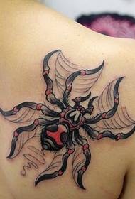 Realistic realistic spider tattoo on the shoulder