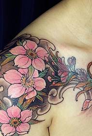 Beautiful flower tattoo on the shoulder