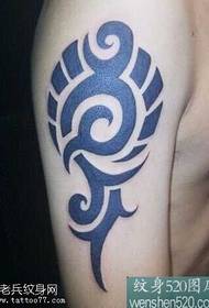 Simple atmospheric totem tattoo on the shoulder