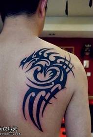 Handsome totem tattoo on the shoulder