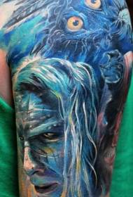 Big arm blue style mysterious man face and feather tattoo pattern