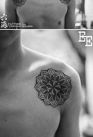 Two twin flowers geometric vanity tattoo pattern on the shoulder