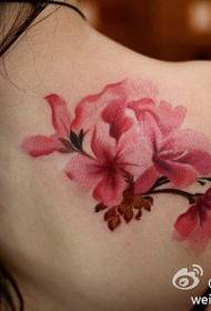 Beautiful pink plum tattoo on the shoulders