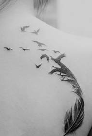 A girl's shoulder and back feathered feather feather tattoo picture
