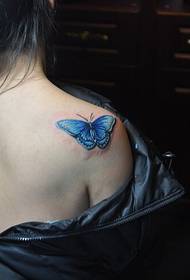 Beautiful tattooed butterfly picture on the back of the beautiful woman