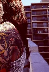 Shoulder portrait flower tattoo