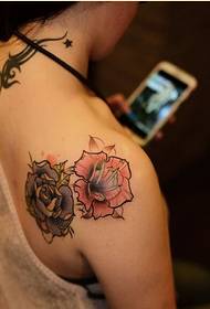 Fashionable female shoulders nice looking sisters rose tattoo picture