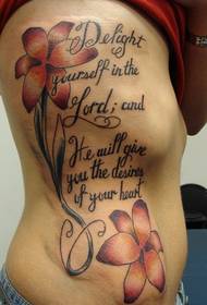 women's side ribs on beautiful flowers and English Bible text tattoos