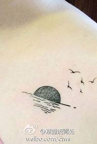 a woman's shoulder seagull tattoo pattern