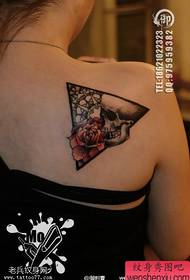 Woman shoulder triangle skull rose tattoo work