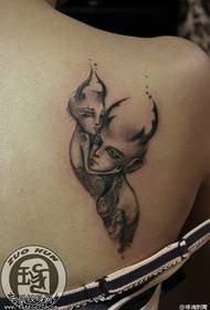 Woman shoulder Gemini tattoo work