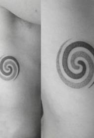 Geometric element tattoo, round tattoo picture on the side of the boy's waist