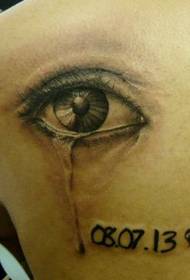 a girl's shoulder tears eye tattoo pattern