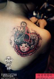 Woman shoulder color clown tattoo work by tattoo