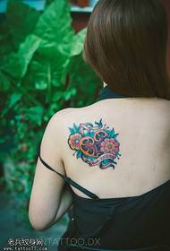 Female back color lock tattoo picture
