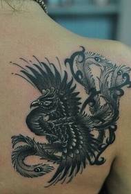Female shoulder black and white phoenix tattoo pattern