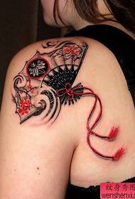 Woman shoulder fan tattoo work