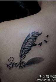 a back feather dove letter tattoo pattern
