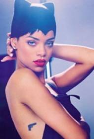 American Tattoo Star Rihanna ခါးတွင်အနက်ရောင်သေနတ်တက်တူးထိုးထားသည်