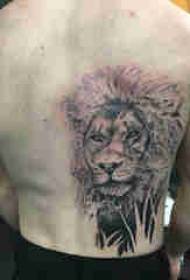 Back waist tattoo, black lion tattoo picture on the back of the boy