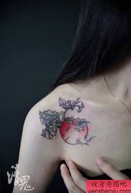 Beautiful female radish tattoo pattern on the shoulder of a girl