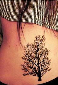 a big tree tattoo tattoo on the back of the girl's waist