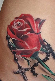 girls waist beautiful rose and cross tattoo