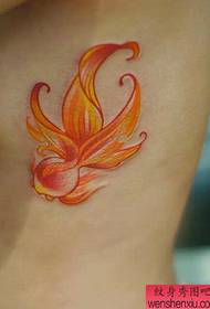 Women's side waist warm color goldfish tattoo work