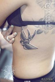female side waist swallow tattoo picture