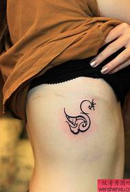 woman's side waist swan tattoo pattern