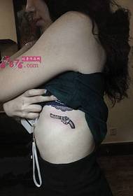 girl side waist small revolver tattoo picture