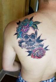 Tattoo girl with back skull tattoo picture