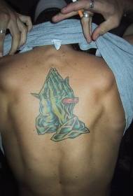 Patrón de tatuaje de mano de oración zombie de color de espalda