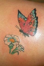 zpět létající krásný motýl a květ tetování vzor