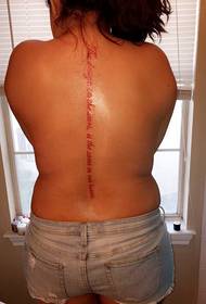 woman's back spine bones on a red line of English word tattoo pictures