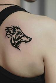 black and white animal tattoo on the back full of personality