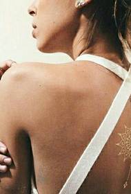 faintly visible girl back invisible tattoo