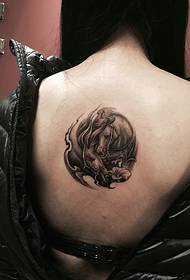 girl's back pony totem tattoo