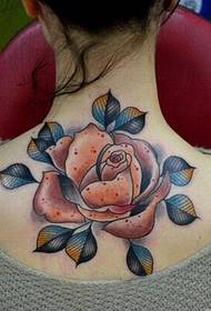 girl's back large beautiful rose tattoo