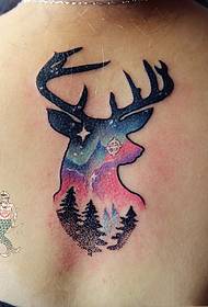 beautiful beauty on the back of the colorful deer head tattoo