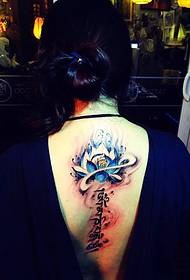 white back with lotus and Sanskrit tattoo together