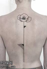 a poppy flower tattoo pattern on the spine
