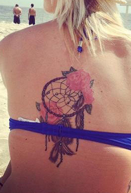 beach girl back dream catcher tattoo