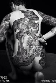 point arrière épine dominatrice ailes hibou motif de tatouage