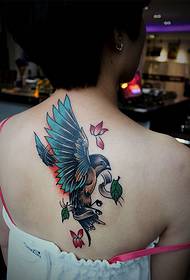 back a beautiful colored little swallow tattoo