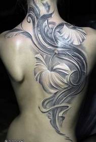 woman back flower tattoo pattern