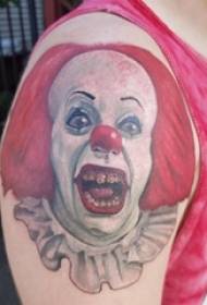 Clown tattoo boy's braso sa clown na larawan ng tattoo