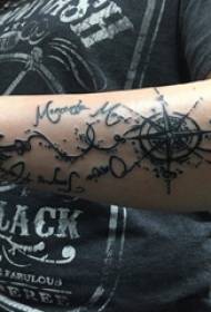 Tattoo arm girl girl arm on english and compass tattoo picture