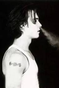 American tattoo star Johnny Depp arm on black gray Indian tattoo picture