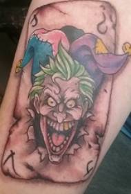 Clown tattoo, male arm, clown and playing cards, tattoo picture